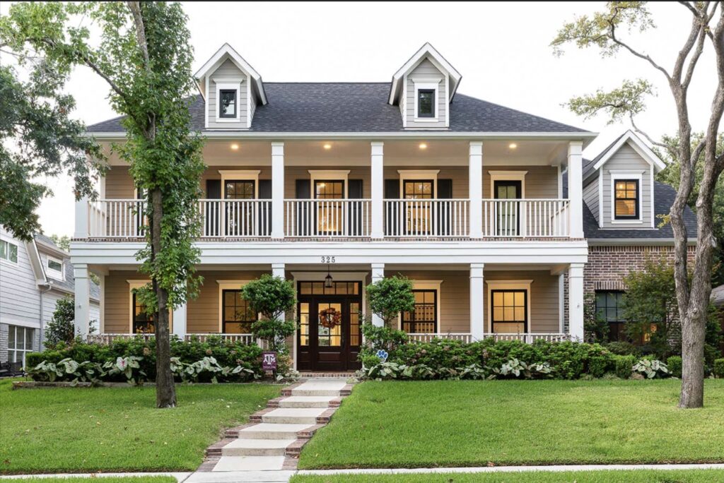 dallas custom home with two story double porch.  Traditional design and classic architectural lines and beautiful red brick.