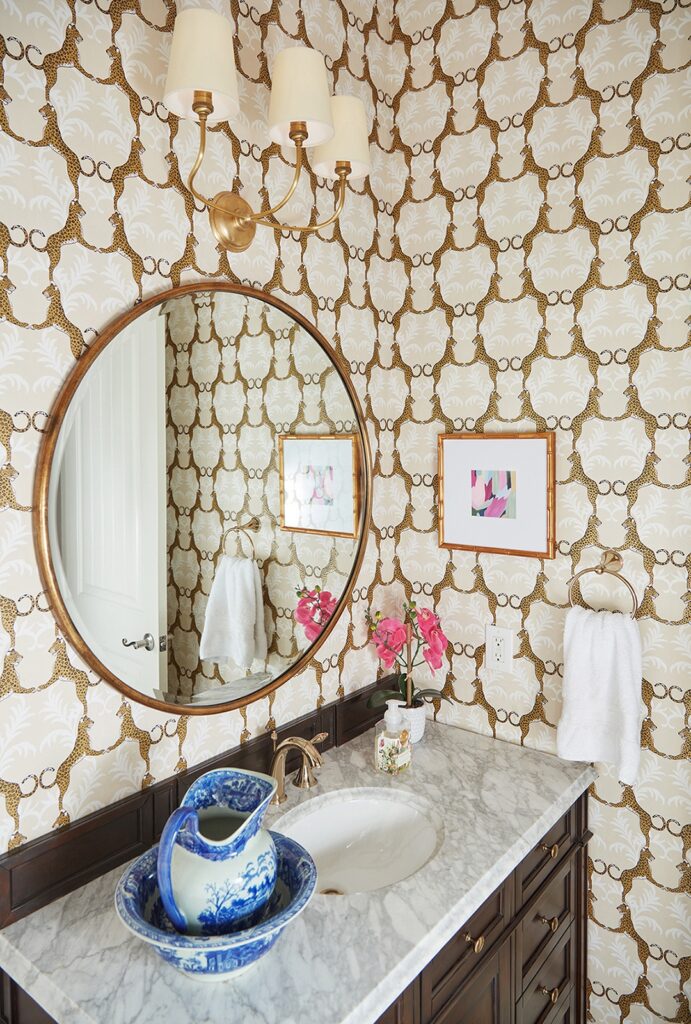 Powder room: Bold wallpaper powder room design by Elizabeth Ryan Interiors Dallas
